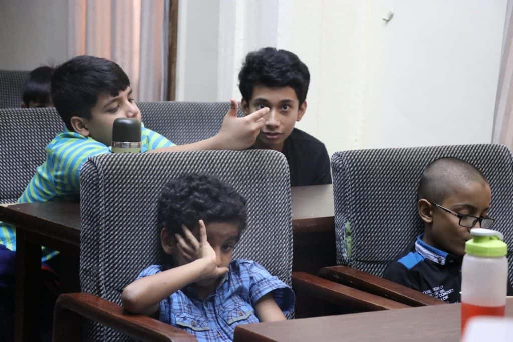 Kids watching attentively