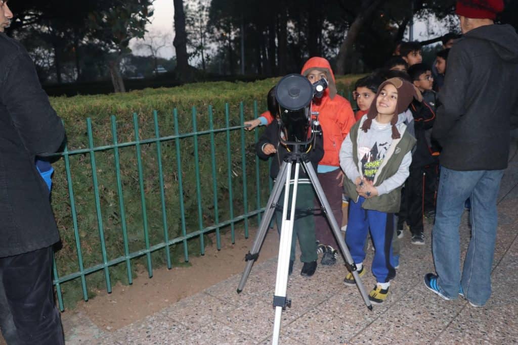 Tripod and telescope outdoors