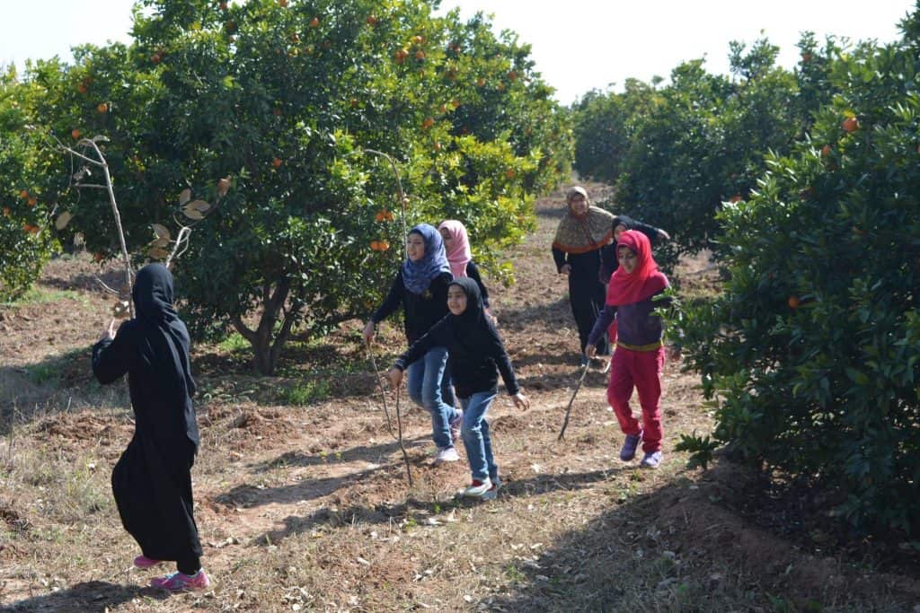 Children watering plants