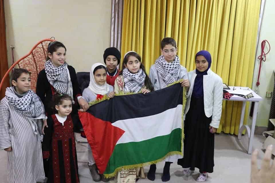 Children holding Palestinian flag