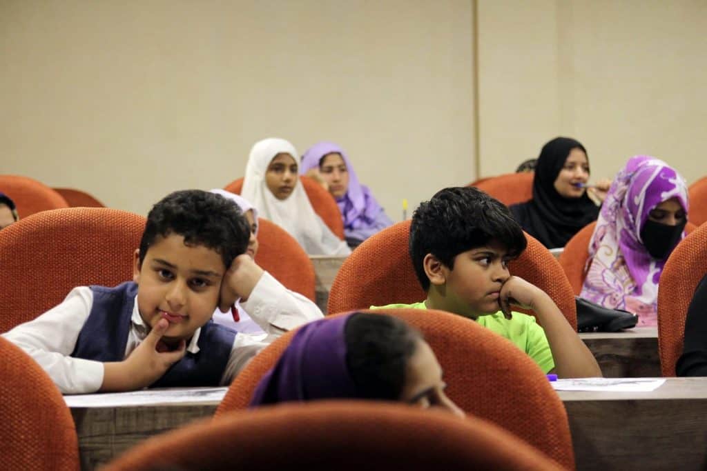 Children seated attentively