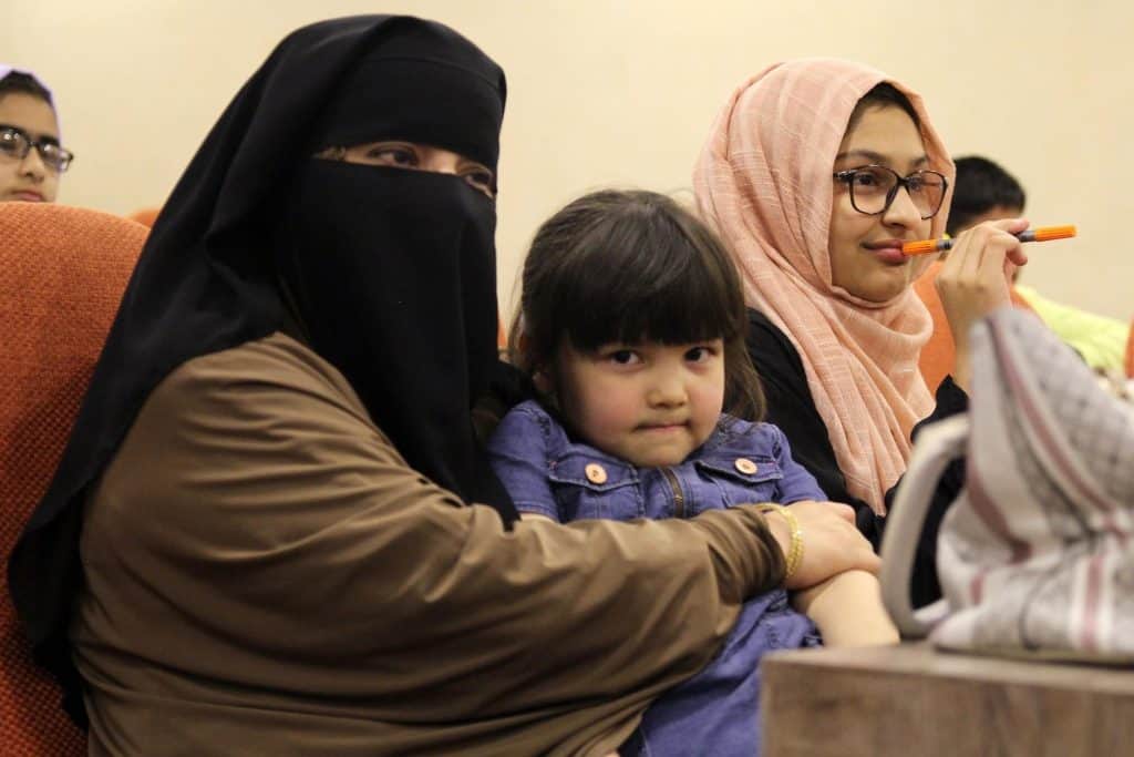 Mother with child in audience