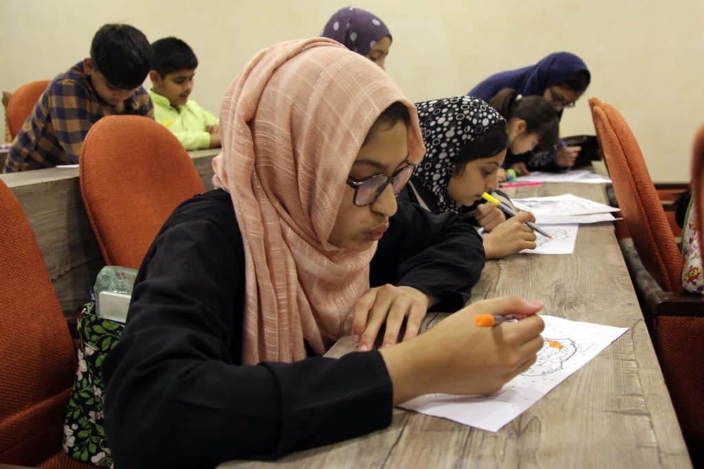 Focused student drawing