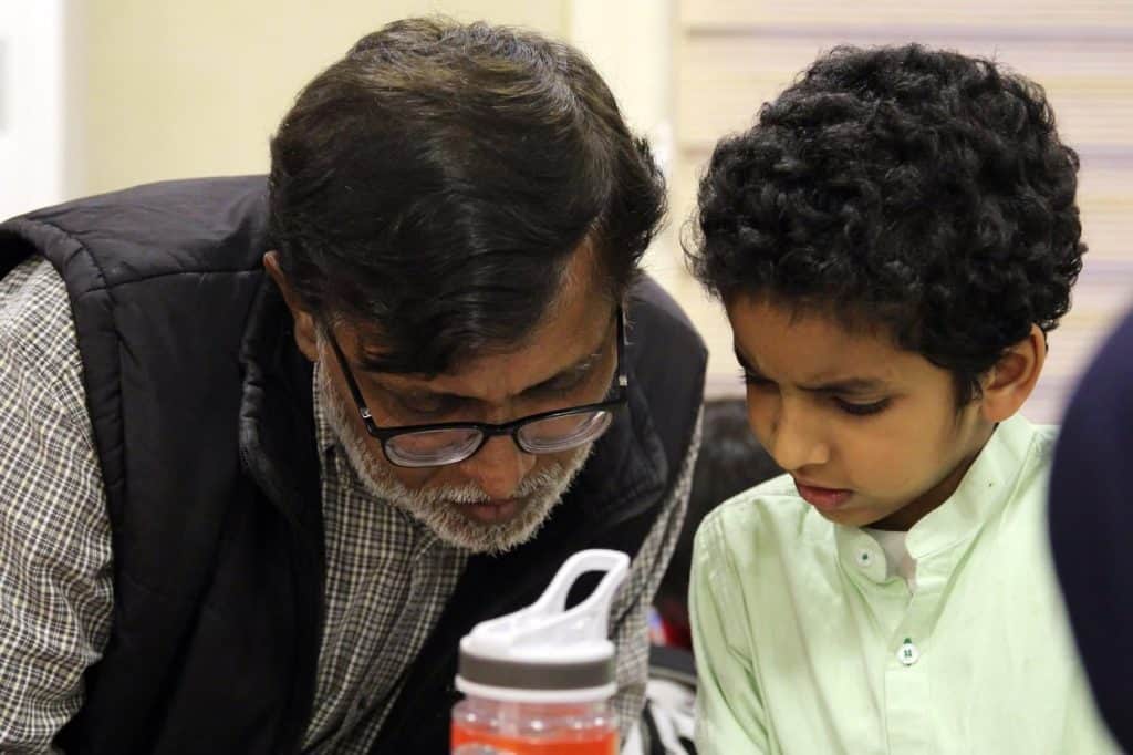 Closeup of mentor with child